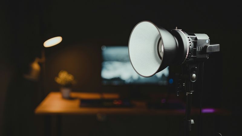 Studio light in front of a creator's desk setup